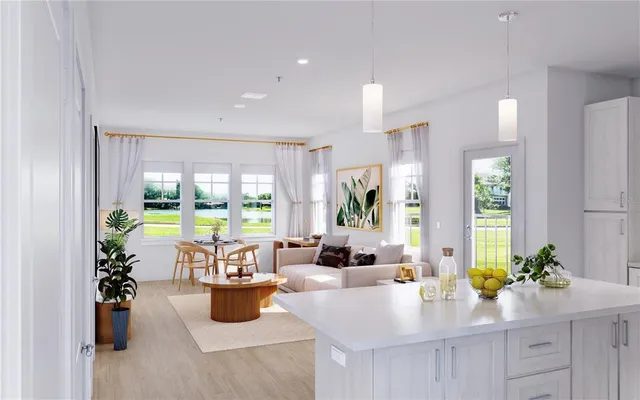 a kitchen with a large counter top and stainless steel appliances