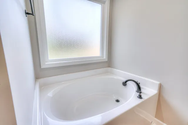 a close view of a bathtub in a bathroom