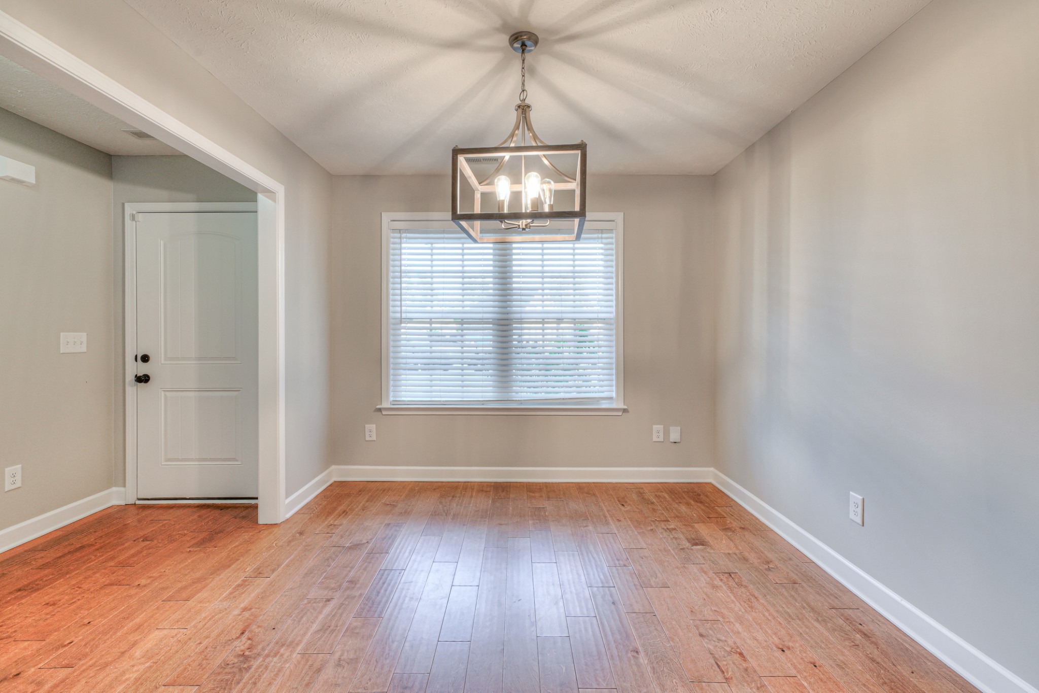 1485 Round Rock Drive Murfreesboro, TN 37128 - Photo 16 of 39 a view of an empty room with wooden floor and a window