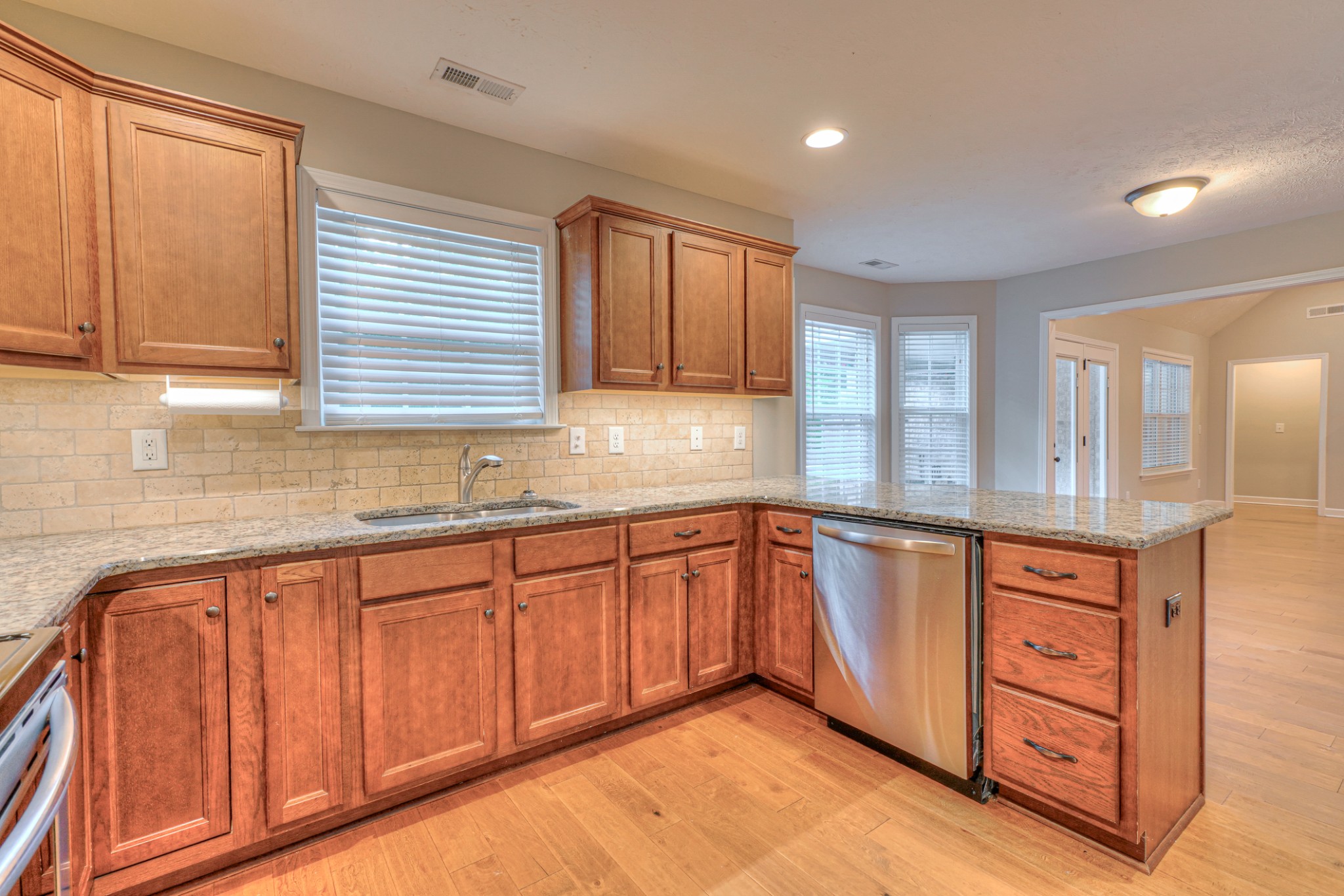 1485 Round Rock Drive Murfreesboro, TN 37128 - Photo 19 of 39 a kitchen with granite countertop sink cabinets and window