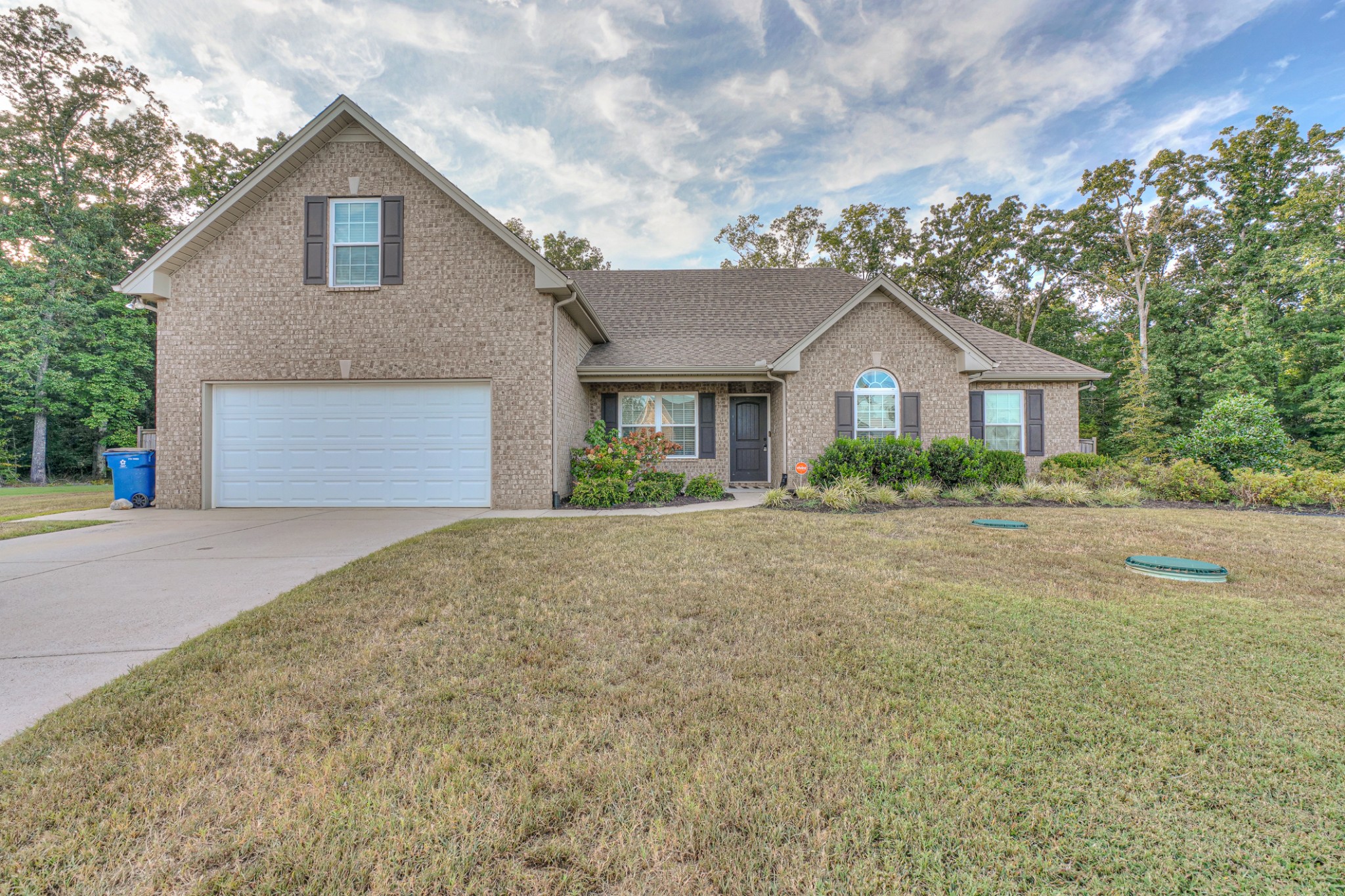 1485 Round Rock Drive Murfreesboro, TN 37128 - Photo 2 of 39 a front view of a house with a yard and garage