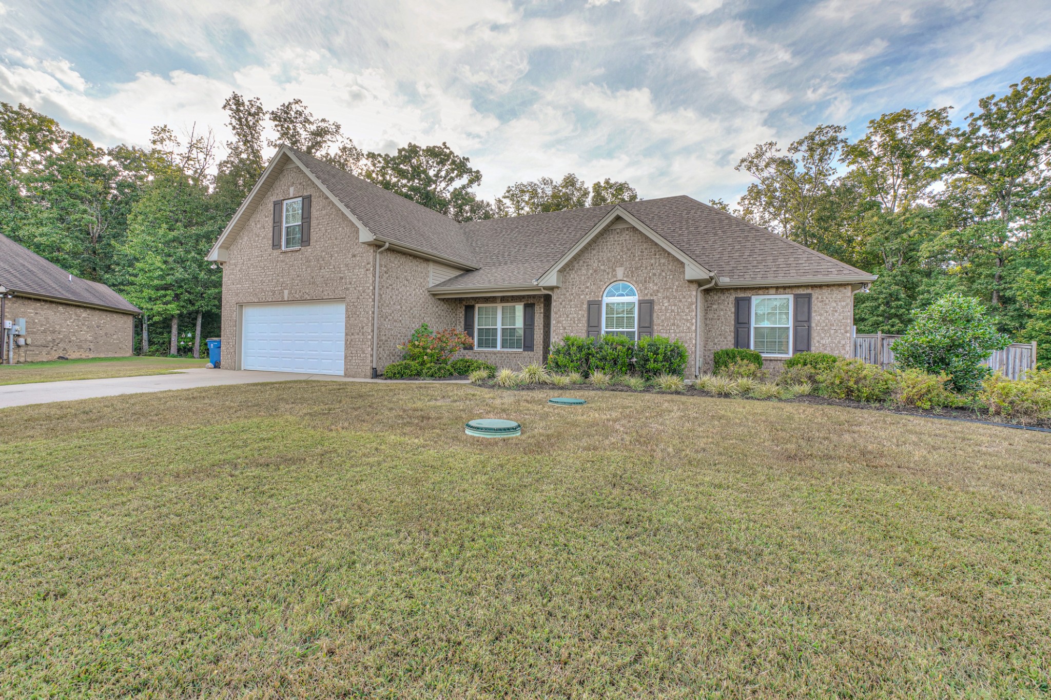 1485 Round Rock Drive Murfreesboro, TN 37128 - Photo 3 of 39 a front view of a house with a garden