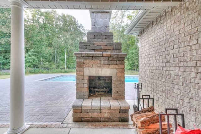a view of a swimming pool with a yard