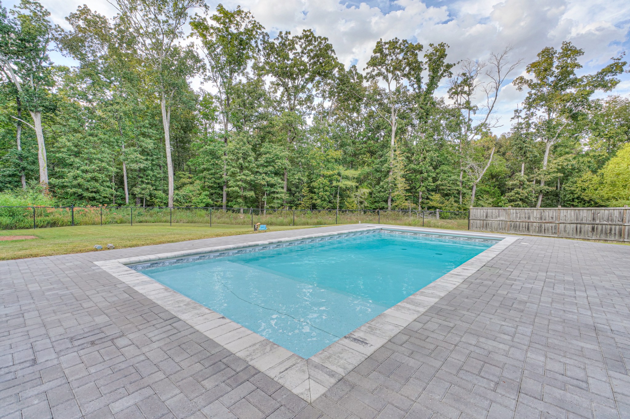 1485 Round Rock Drive Murfreesboro, TN 37128 - Photo 32 of 39 a view of a swimming pool with a yard