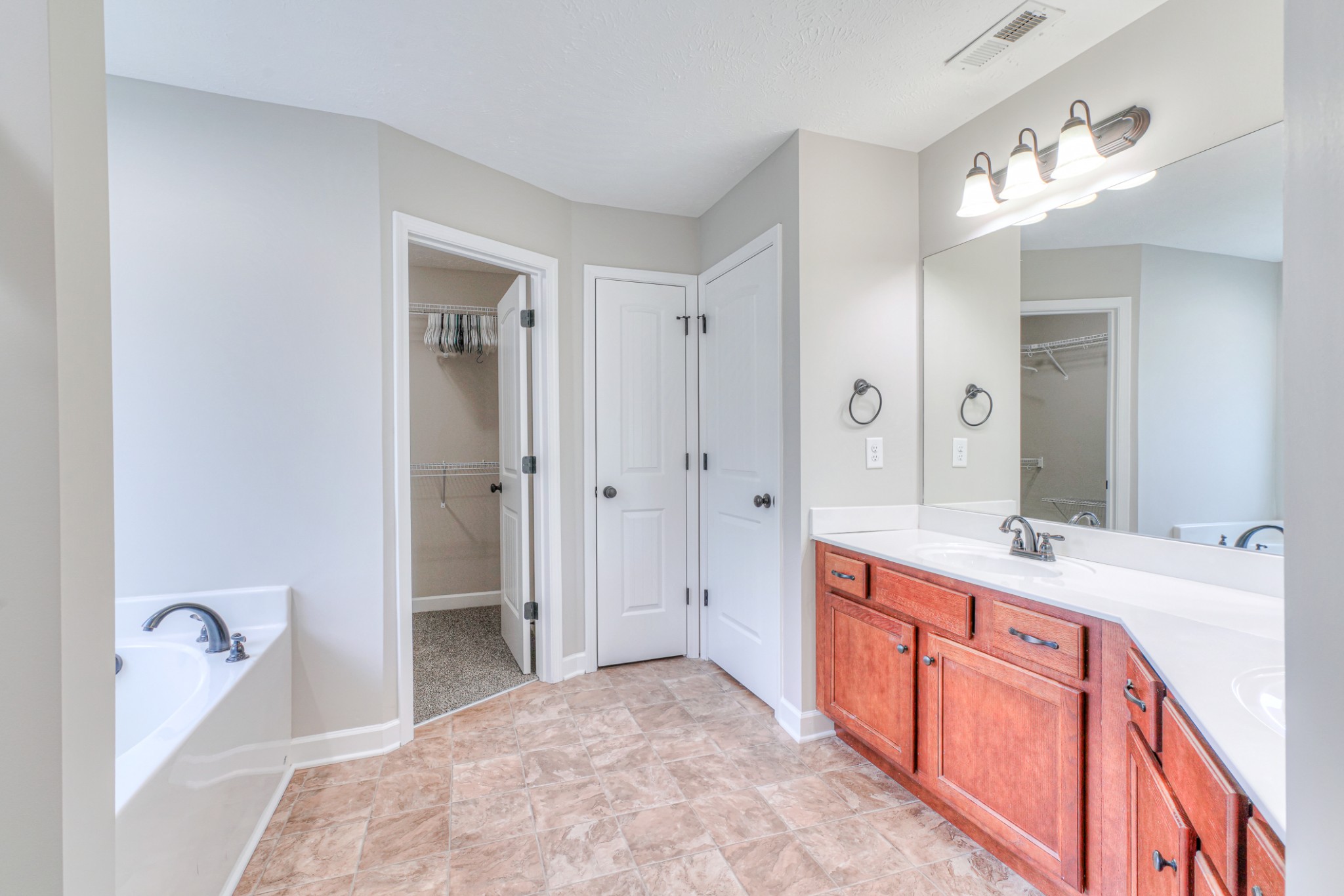 1485 Round Rock Drive Murfreesboro, TN 37128 - Photo 10 of 39 a spacious bathroom with a tub sink and mirror