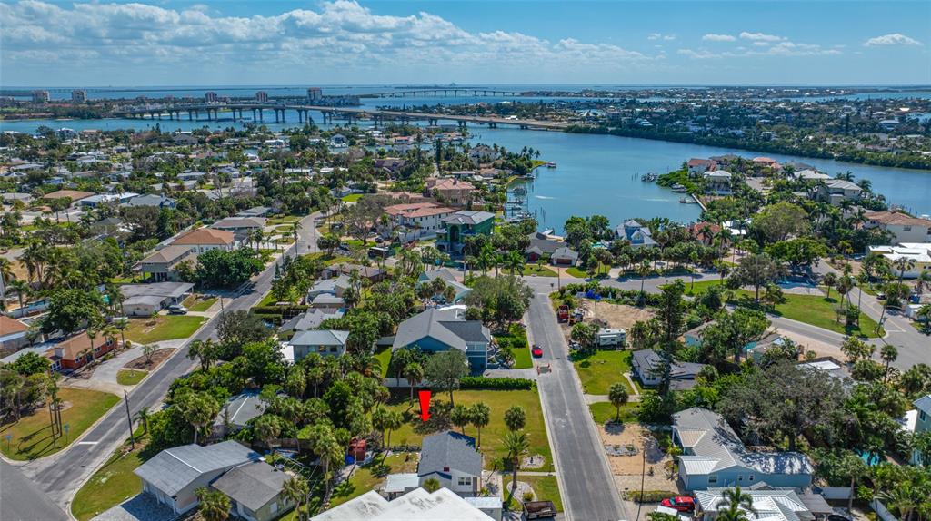 3961 Oleander Way St. Pete Beach, FL 33706 - Photo 12 of 15 an aerial view of a city and lake view