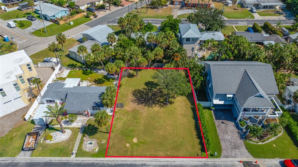 3961 Oleander Way St. Pete Beach, FL 33706 - Photo 2 of 15 an aerial view of residential houses with outdoor space