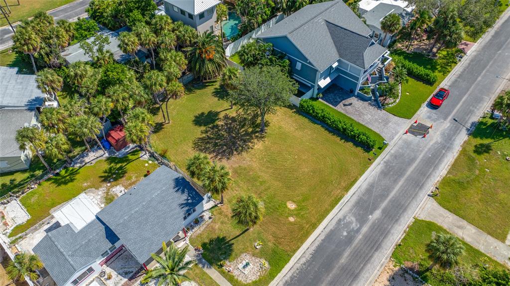 3961 Oleander Way St. Pete Beach, FL 33706 - Photo 4 of 15 an aerial view of a house with a yard