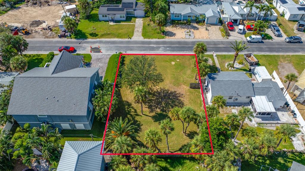 3961 Oleander Way St. Pete Beach, FL 33706 - Photo 8 of 15 an aerial view of a house with a garden