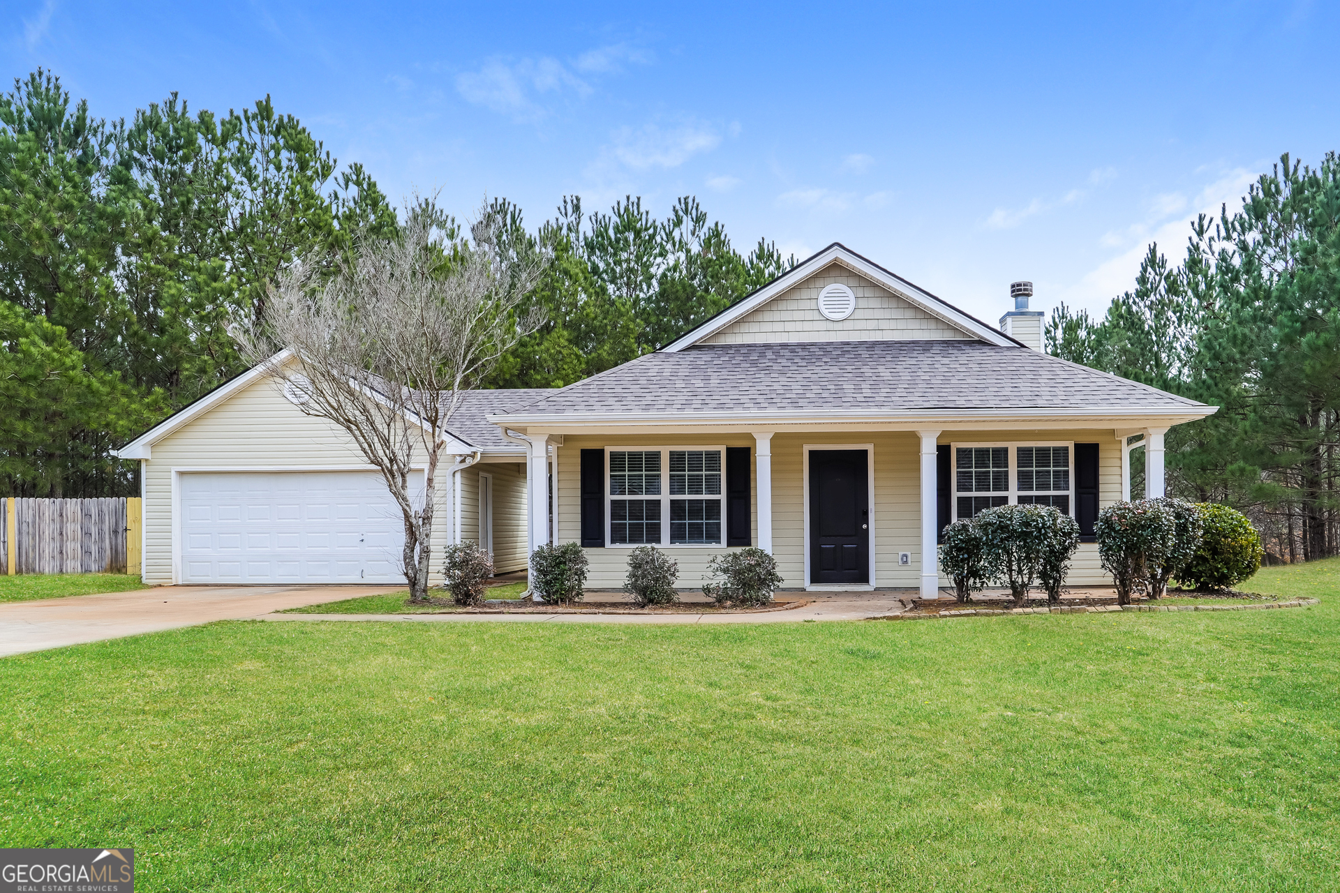 4976 Wolfcreek View South Fulton, GA 30349 - Photo 1 of 17 a front view of house with yard and green space