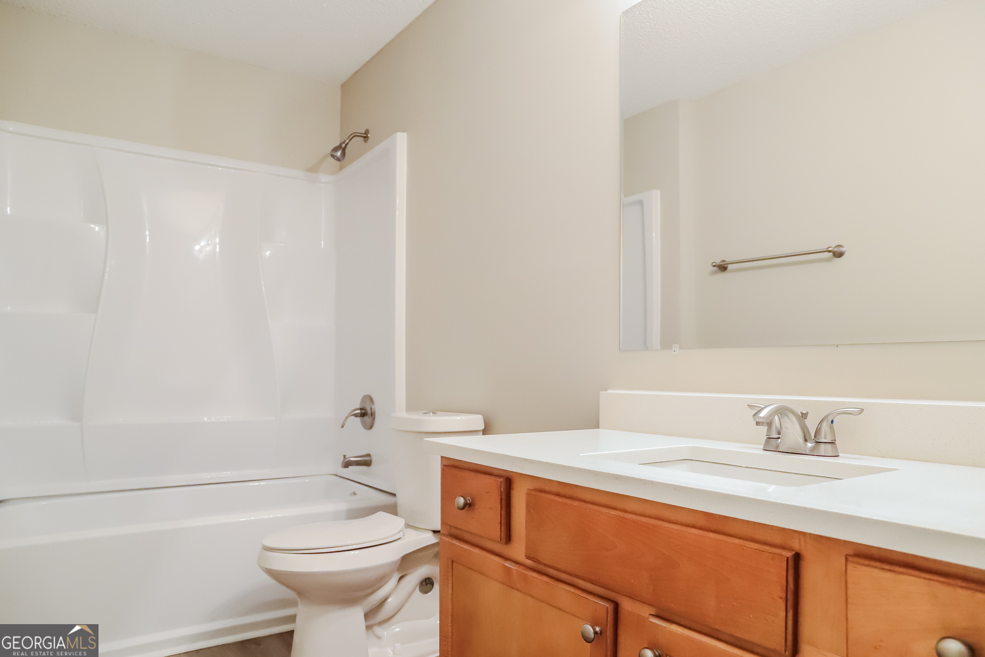 4976 Wolfcreek View South Fulton, GA 30349 - Photo 13 of 17 a bathroom with a sink a toilet and shower