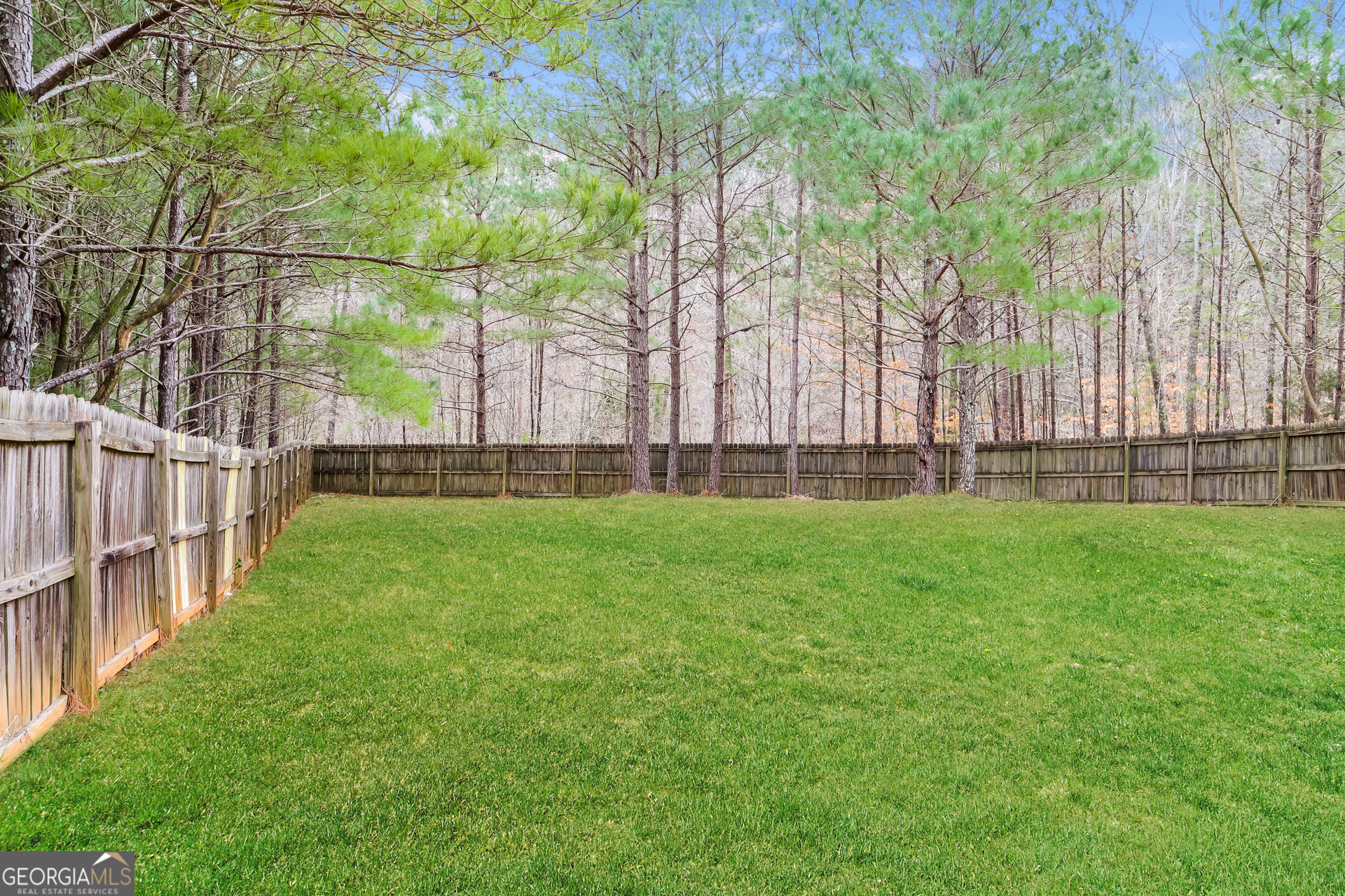 4976 Wolfcreek View South Fulton, GA 30349 - Photo 16 of 17 a view of yard with grass and trees