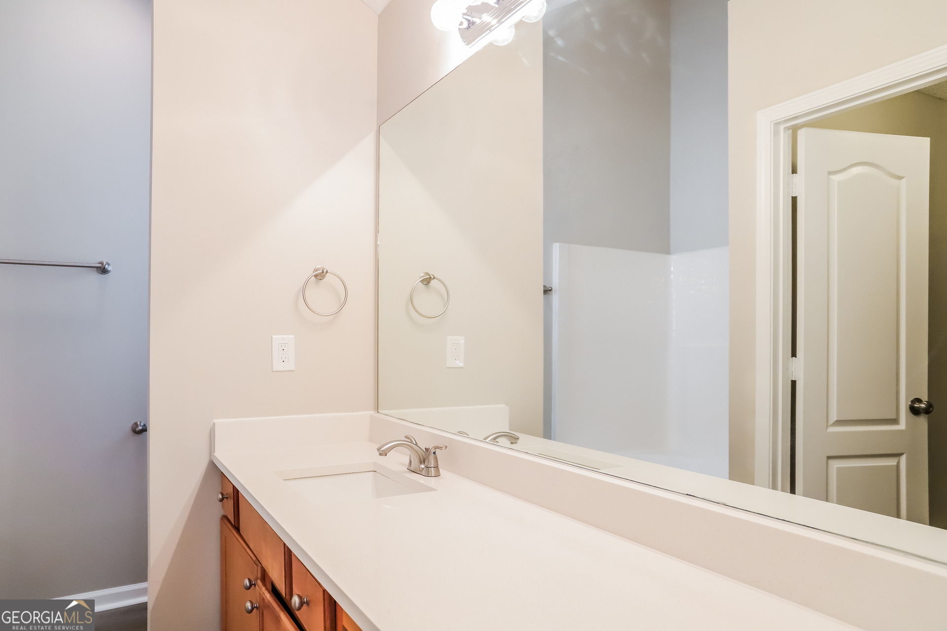 4976 Wolfcreek View South Fulton, GA 30349 - Photo 9 of 17 a bathroom with a sink and a mirror
