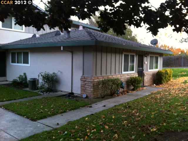 2305 Foothill Road, Unit 1 Pleasanton, CA 94588 - Photo 1 of 1 a front view of a house with a garden