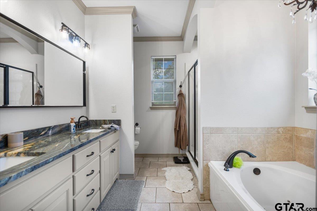 21192 Altuda Lane Flint, TX 75762 - Photo 26 of 46 a bathroom with a granite countertop sink and a mirror