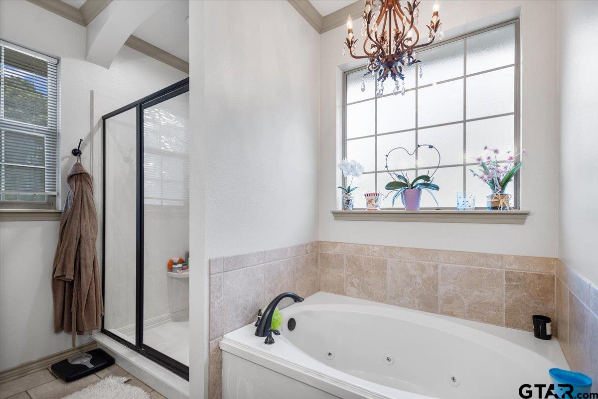 21192 Altuda Lane Flint, TX 75762 - Photo 28 of 46 a bathroom with a bathtub and shower