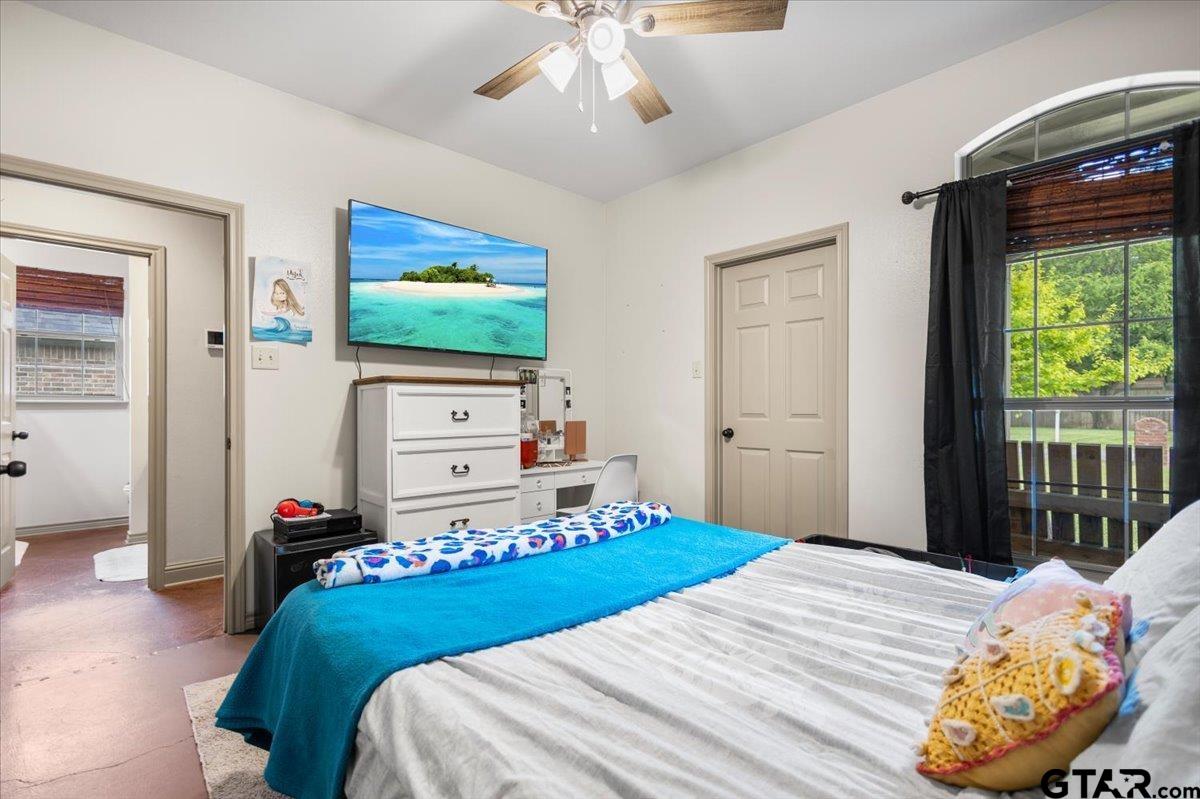 21192 Altuda Lane Flint, TX 75762 - Photo 34 of 46 a bedroom with a bed and a flat screen tv