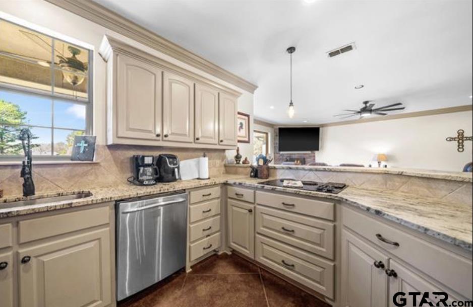 21192 Altuda Lane Flint, TX 75762 - Photo 9 of 46 a kitchen with granite countertop a sink stainless steel appliances and cabinets