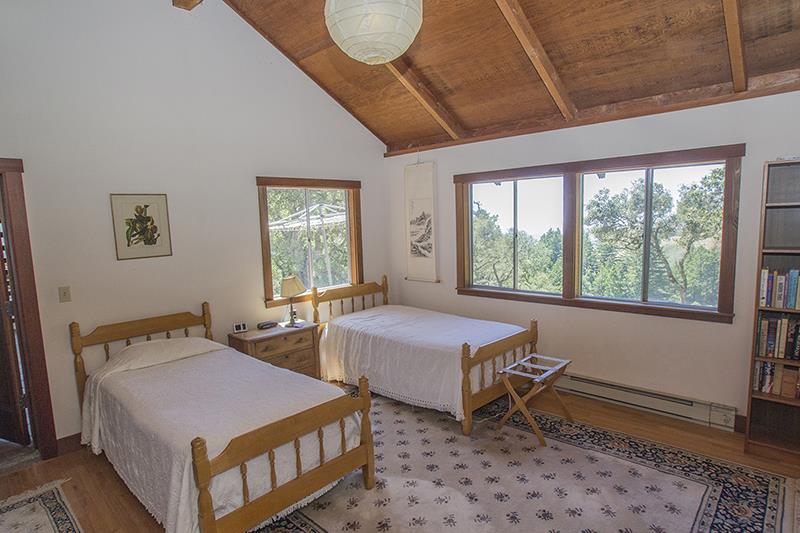 227 Rapley Ranch Road La Honda, CA 94020 - Photo 13 of 35 a bedroom with two beds and a window