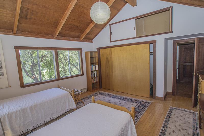 227 Rapley Ranch Road La Honda, CA 94020 - Photo 15 of 35 a bedroom with a bed and a window