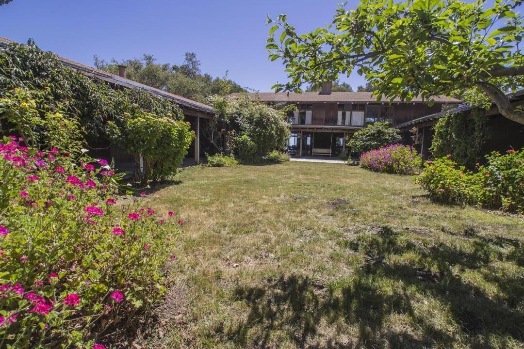 227 Rapley Ranch Road La Honda, CA 94020 - Photo 2 of 35 a view of a house with a flower garden