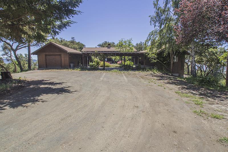 227 Rapley Ranch Road La Honda, CA 94020 - Photo 21 of 35 a front view of a house with a yard and wooden fence