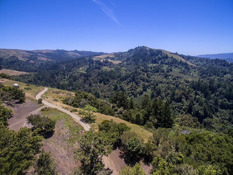 227 Rapley Ranch Road La Honda, CA 94020 - Photo 25 of 35 a view of a field with mountains in the background
