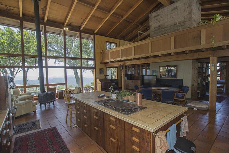 227 Rapley Ranch Road La Honda, CA 94020 - Photo 7 of 35 a kitchen with a table chairs and wooden floor