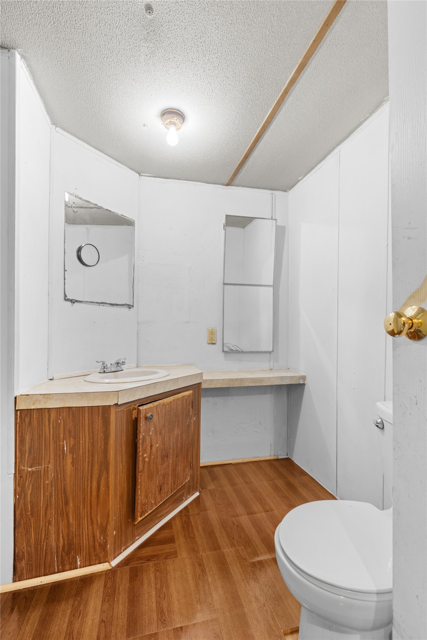 370 Lakeside Drive Trinity, TX 75862 - Photo 14 of 23 a bathroom with a sink a toilet and mirror