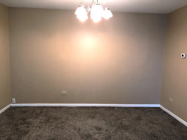 a kitchen with a refrigerator a stove a washer and dryer