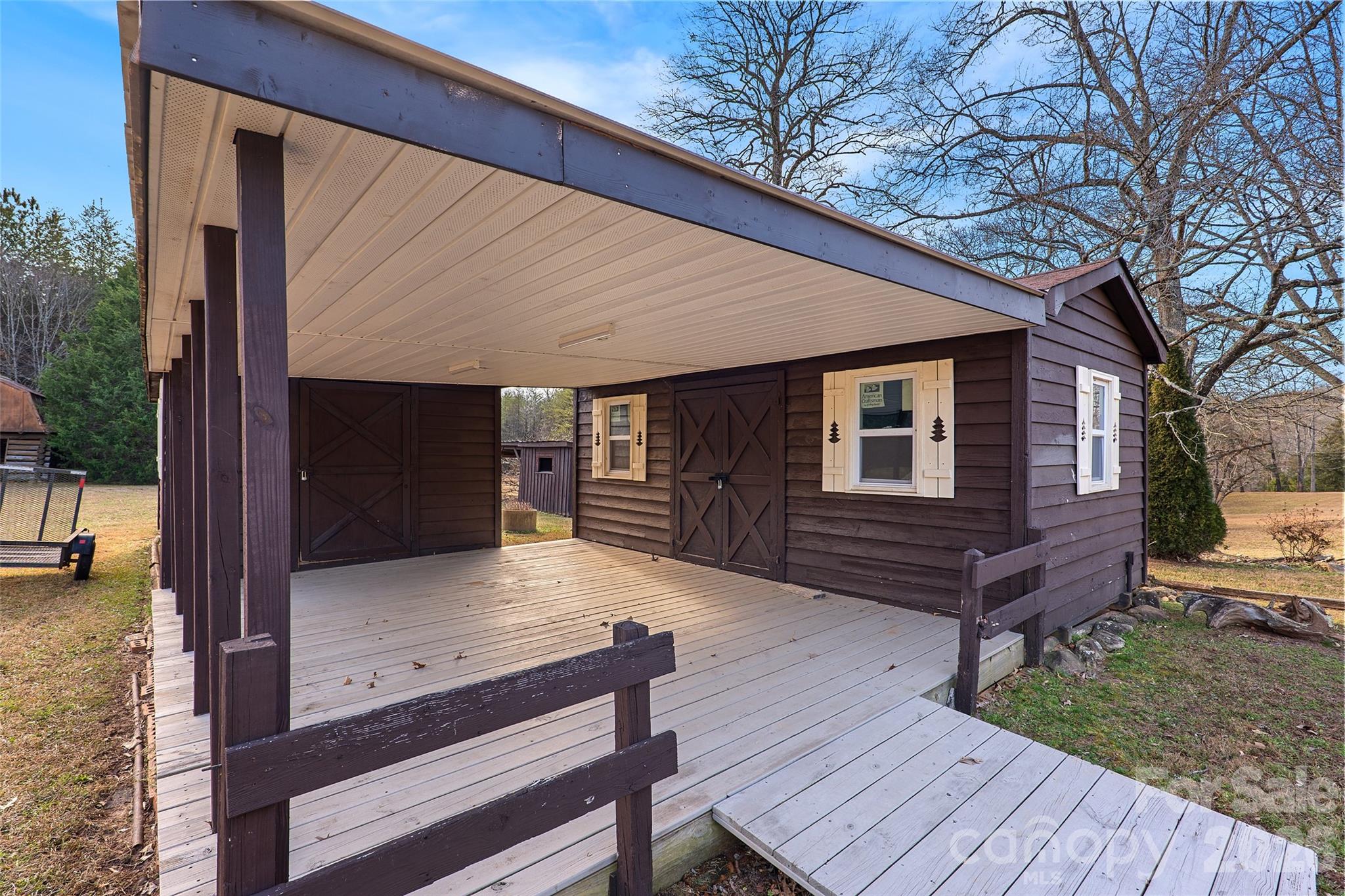 591 Landrum Road Tryon, NC 28782 - Photo 6 of 48 a view of house with backyard and wooden floor