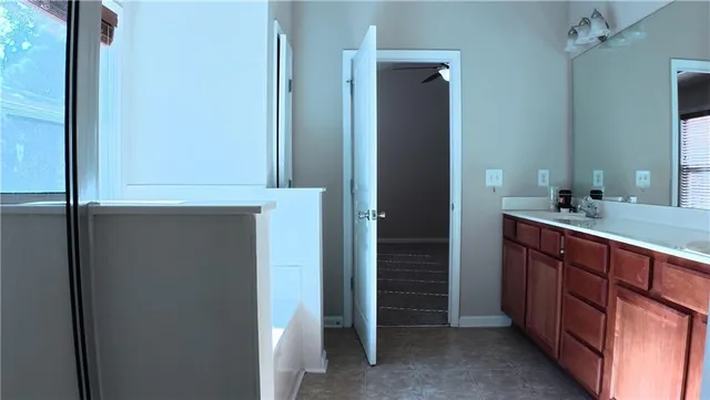 a bathroom with a double vanity sink and a mirror
