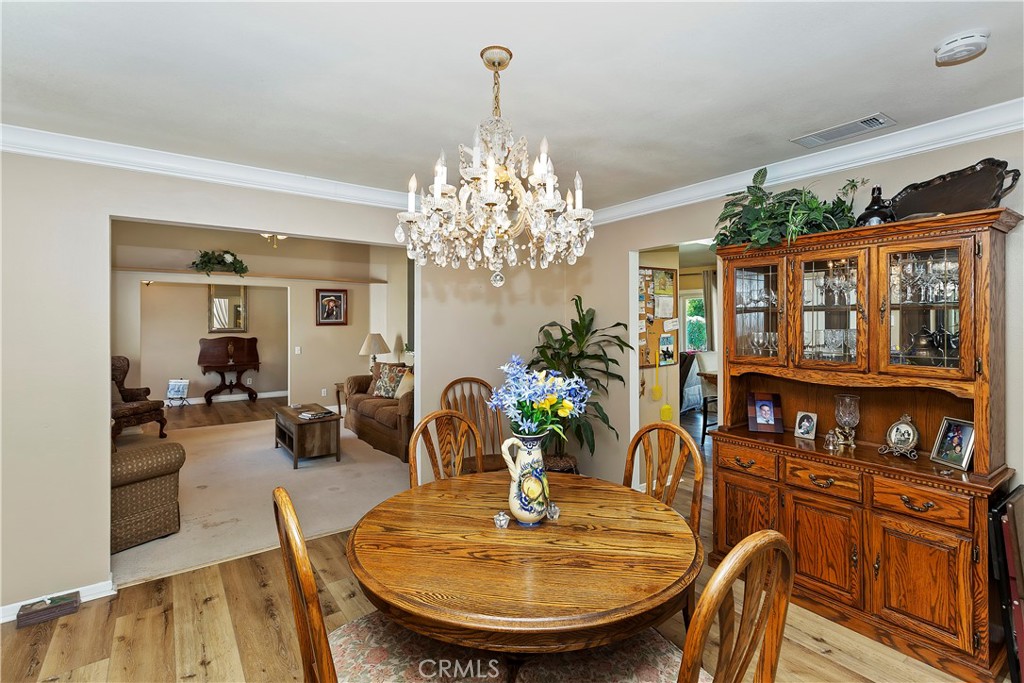 17411 Kaison Circle Riverside, CA 92508 - Photo 13 of 51 a view of a dining room with furniture and chandelier
