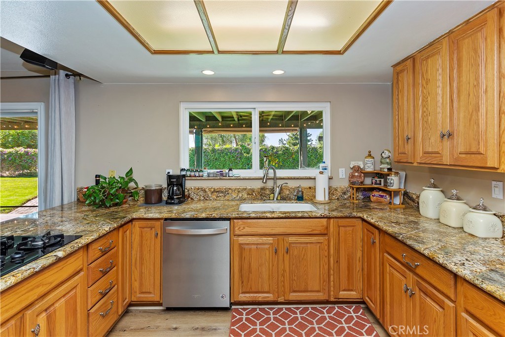 17411 Kaison Circle Riverside, CA 92508 - Photo 14 of 51 a kitchen with a sink stove and cabinets