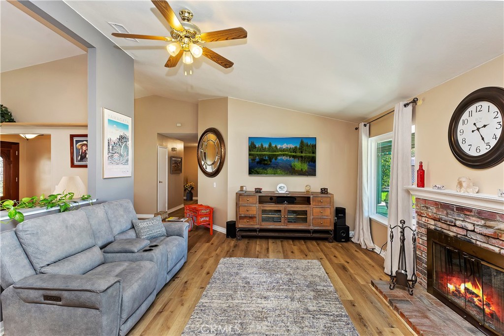 17411 Kaison Circle Riverside, CA 92508 - Photo 18 of 51 a living room with furniture a flat screen tv and a fireplace