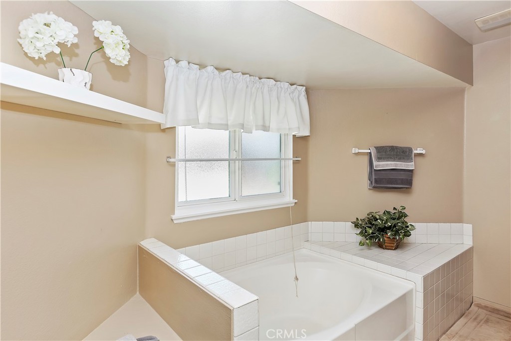 17411 Kaison Circle Riverside, CA 92508 - Photo 29 of 51 a white bath tub sitting next to a white sink