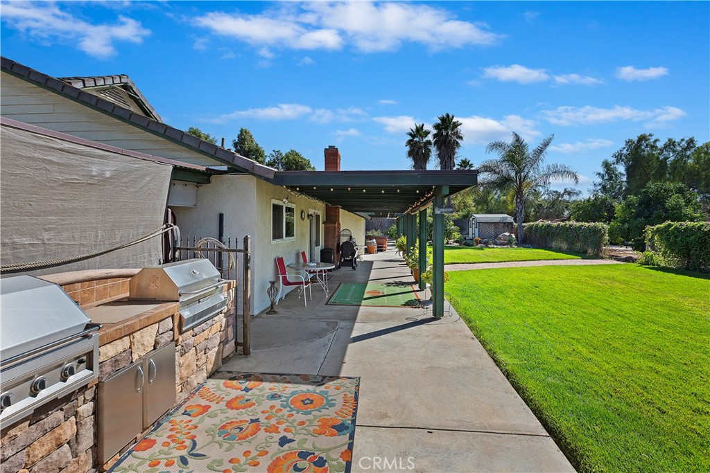17411 Kaison Circle Riverside, CA 92508 - Photo 33 of 51 a view of a porch with furniture and a yard