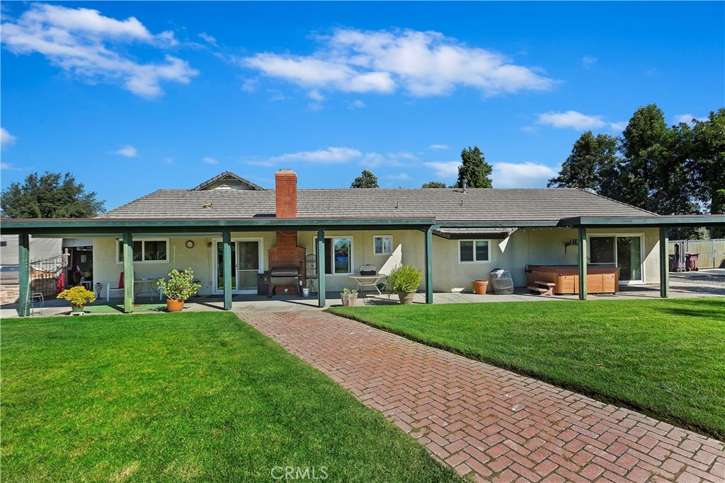 17411 Kaison Circle Riverside, CA 92508 - Photo 36 of 51 a front view of a house with a garden and porch