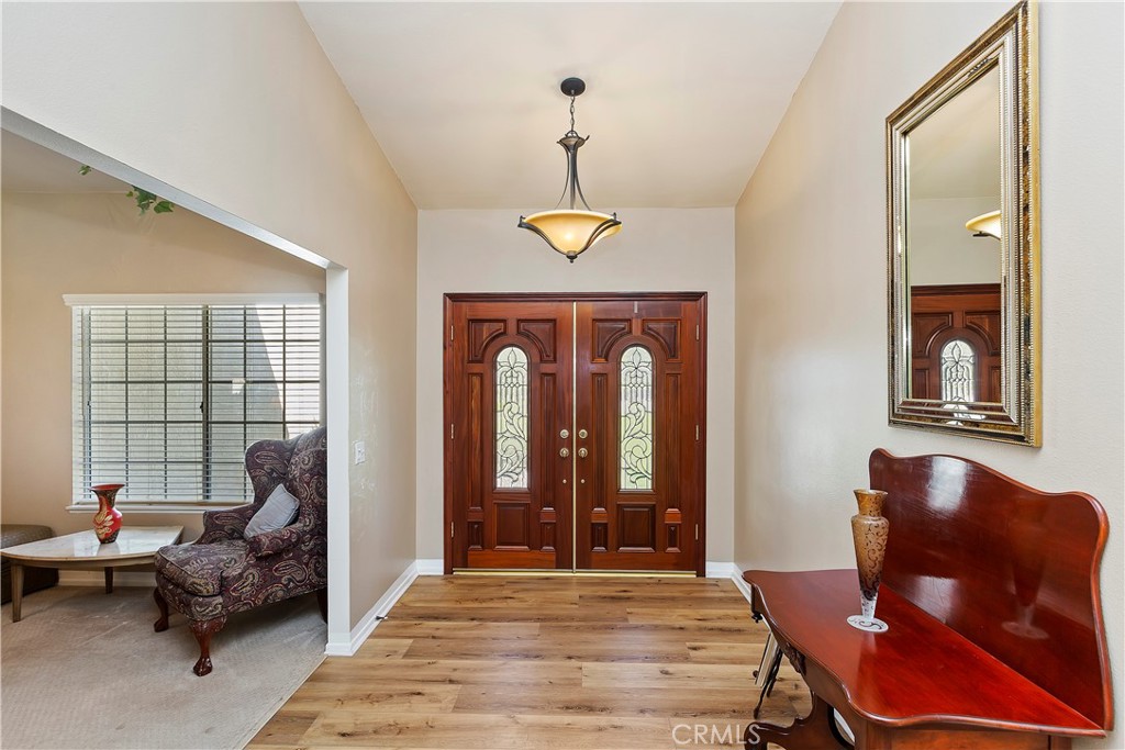 17411 Kaison Circle Riverside, CA 92508 - Photo 10 of 51 a living room with furniture two window and a chandelier