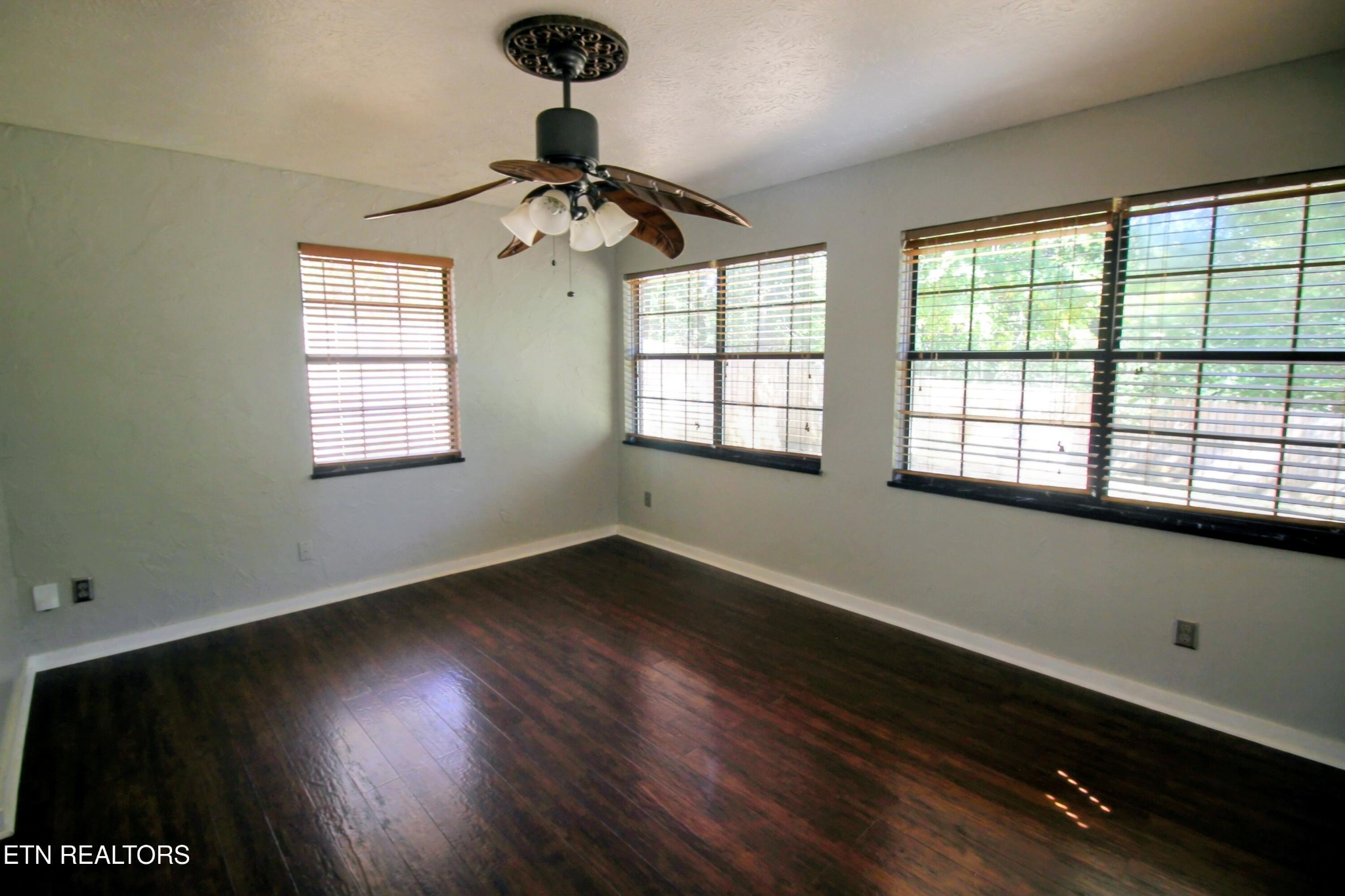 2523 Chukar Road Knoxville, TN 37923 - Photo 11 of 33 a view of an empty room with wooden floor and a window