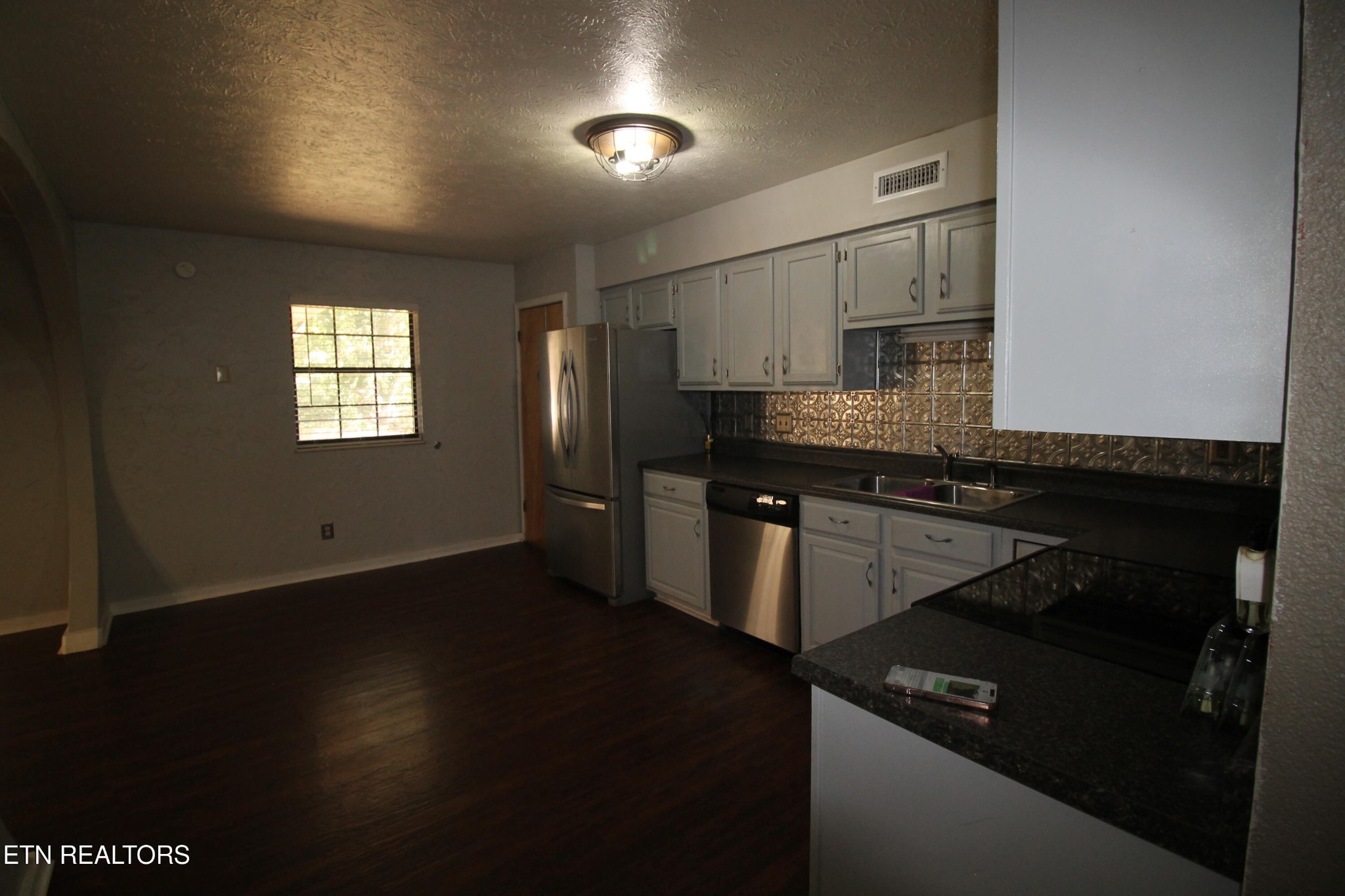 2523 Chukar Road Knoxville, TN 37923 - Photo 18 of 33 a kitchen with granite countertop stainless steel appliances and wooden cabinets