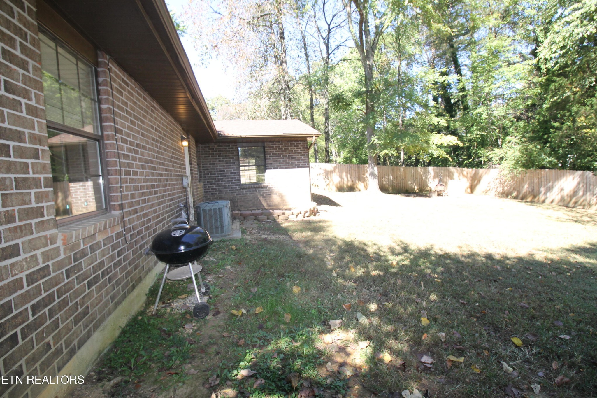 2523 Chukar Road Knoxville, TN 37923 - Photo 5 of 33 a backyard of a house with a yard and seating area