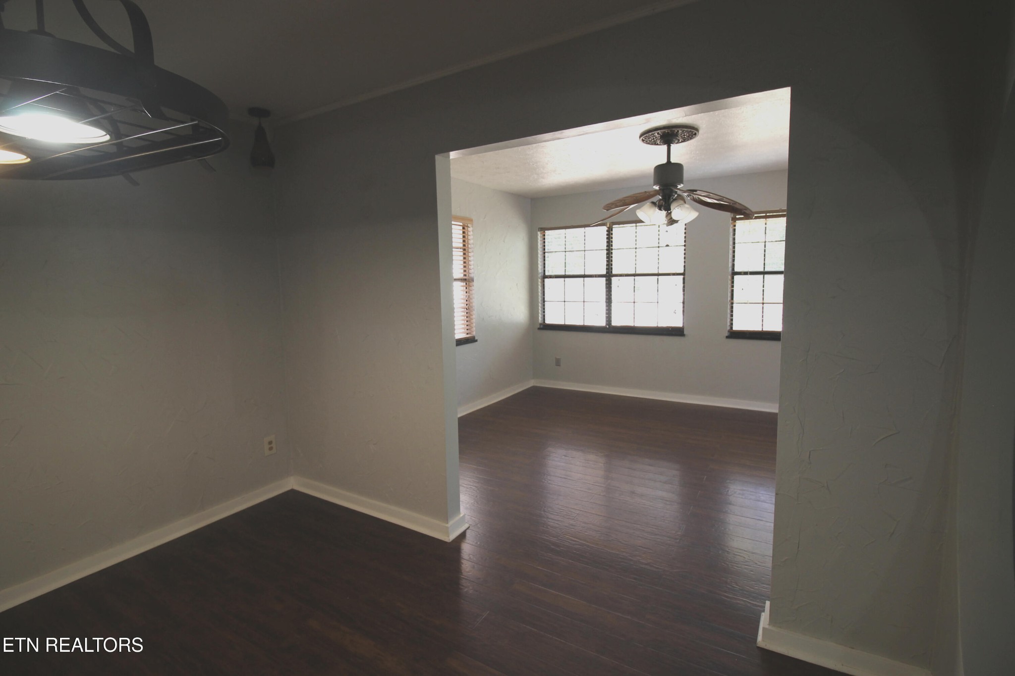 2523 Chukar Road Knoxville, TN 37923 - Photo 8 of 33 an empty room with wooden floor and windows