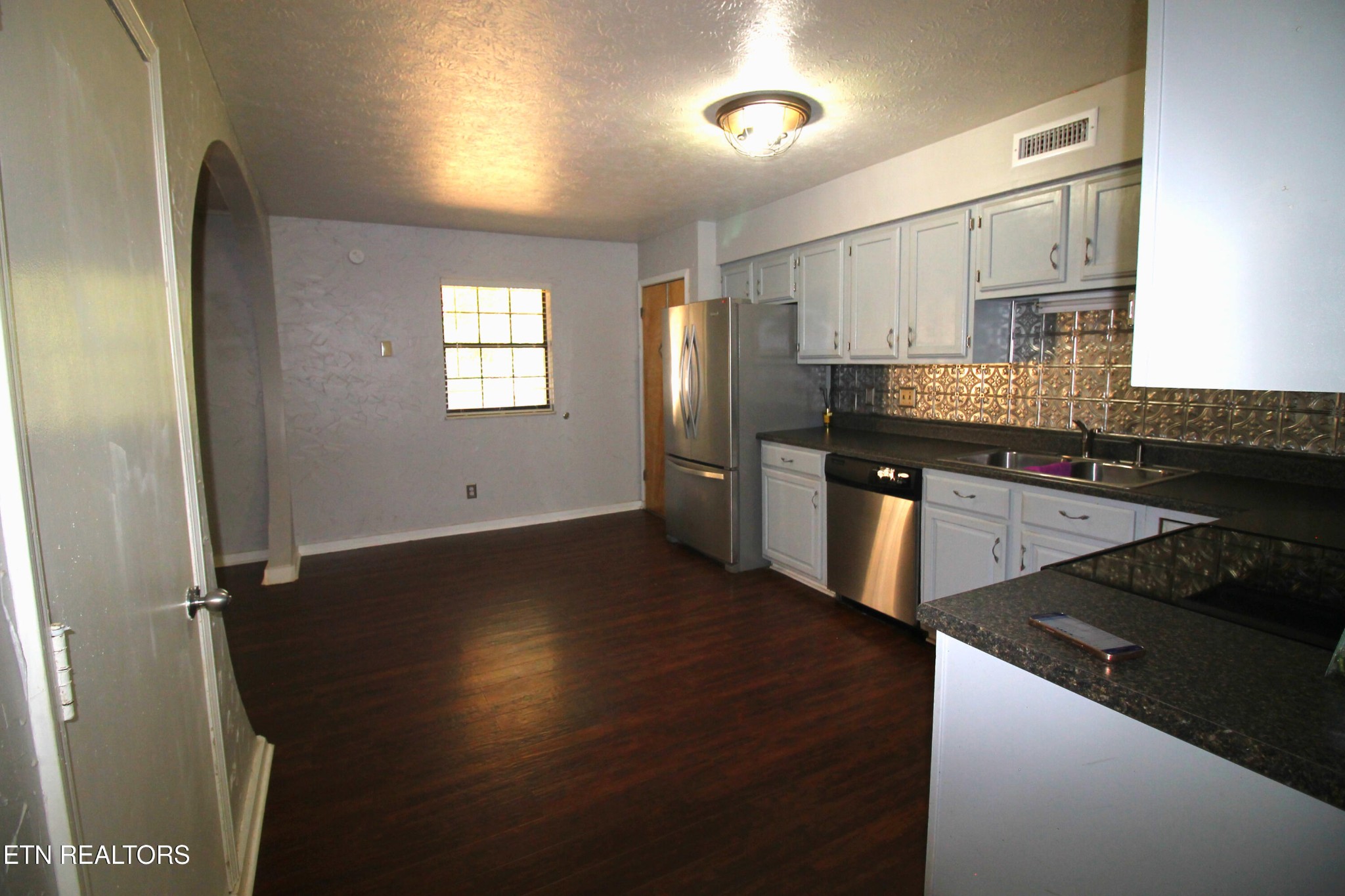 2523 Chukar Road Knoxville, TN 37923 - Photo 10 of 33 a kitchen with granite countertop stainless steel appliances a sink stove and refrigerator