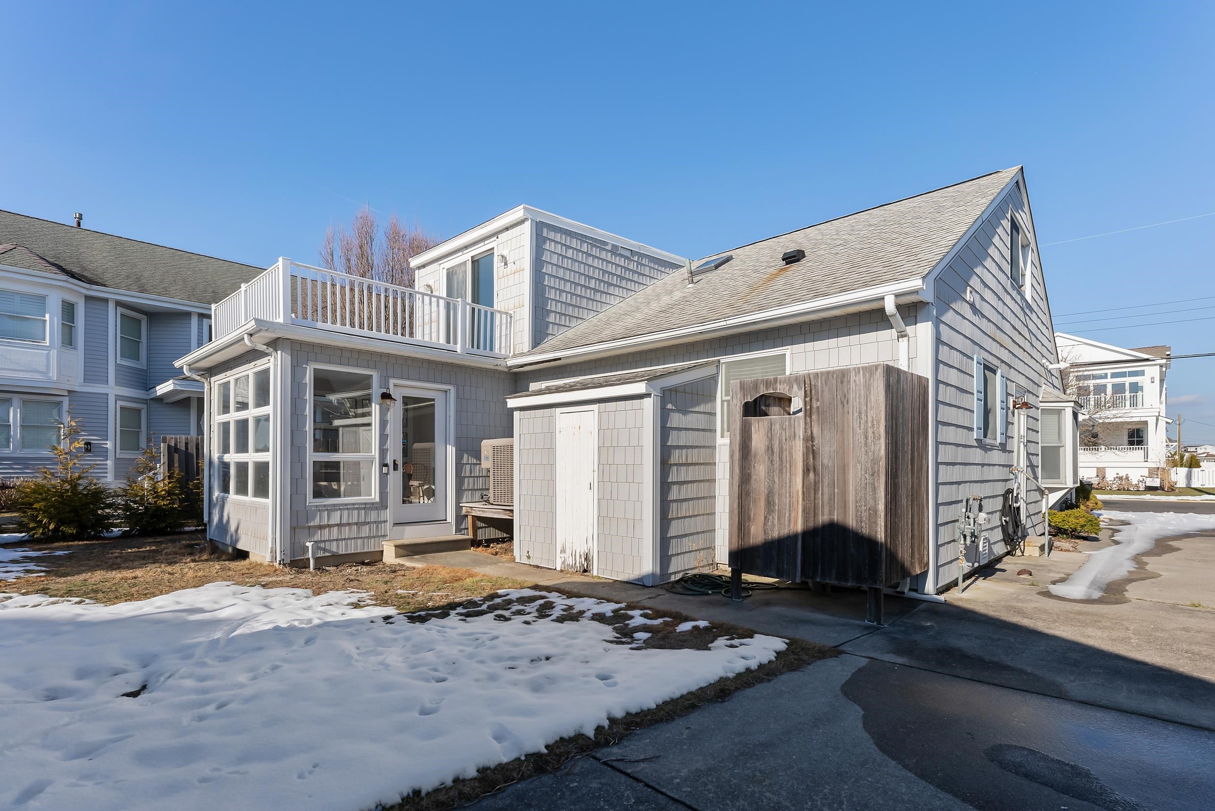 274 52nd Street Avalon, NJ 08202 - Photo 11 of 39 a front view of a house with a yard
