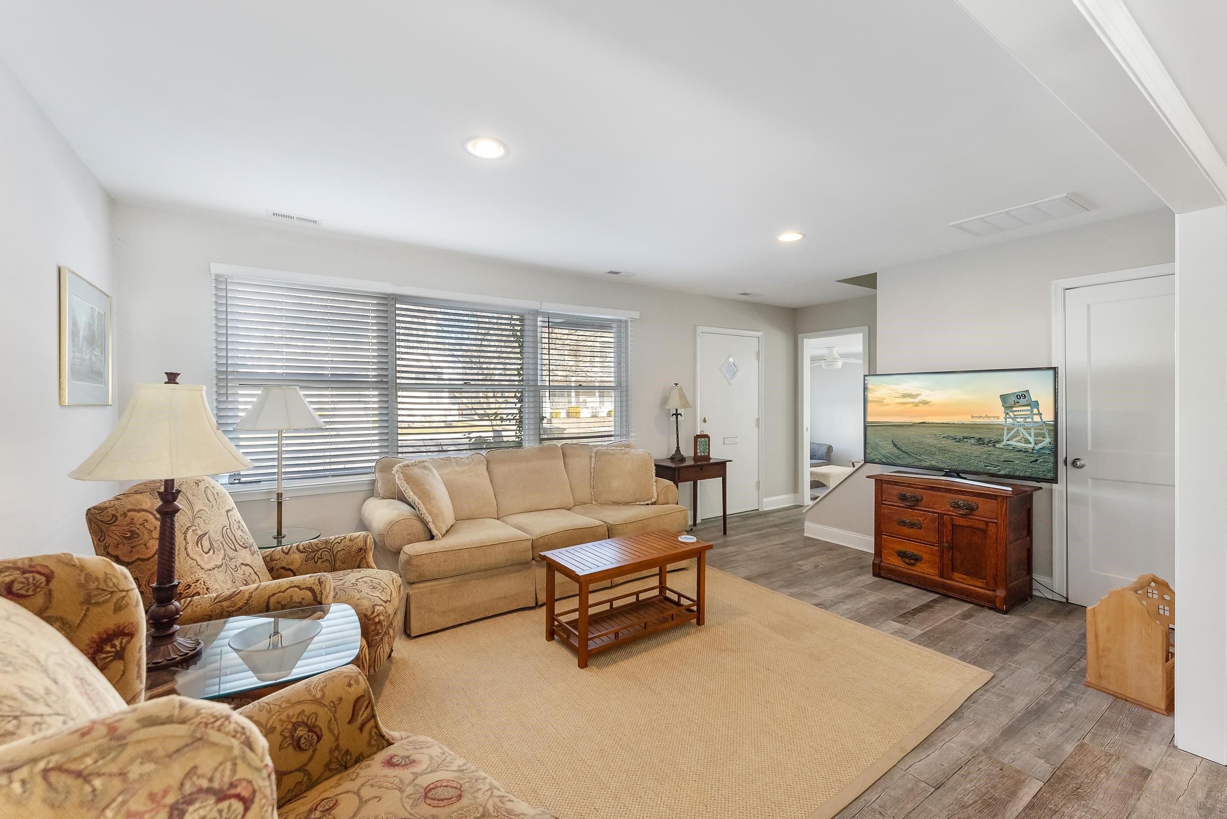274 52nd Street Avalon, NJ 08202 - Photo 16 of 39 a living room with furniture and a flat screen tv