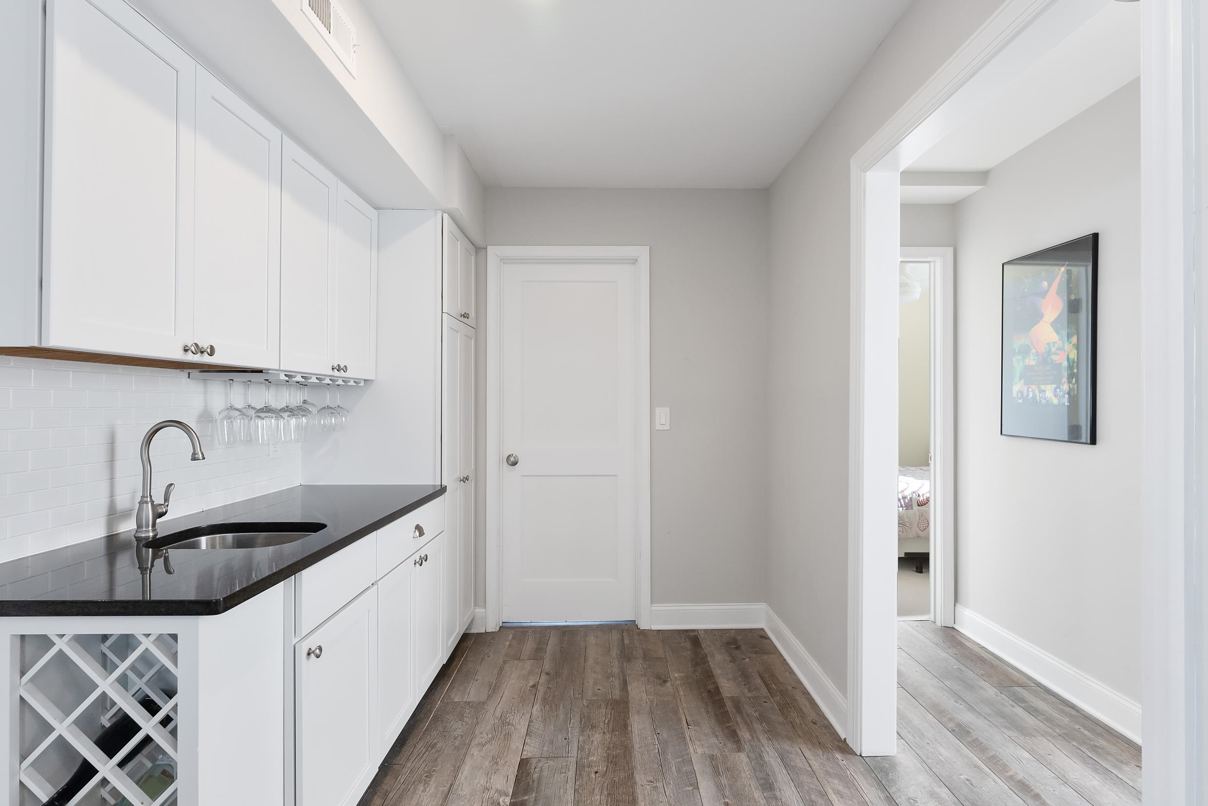 274 52nd Street Avalon, NJ 08202 - Photo 26 of 39 a kitchen with granite countertop a sink and cabinets