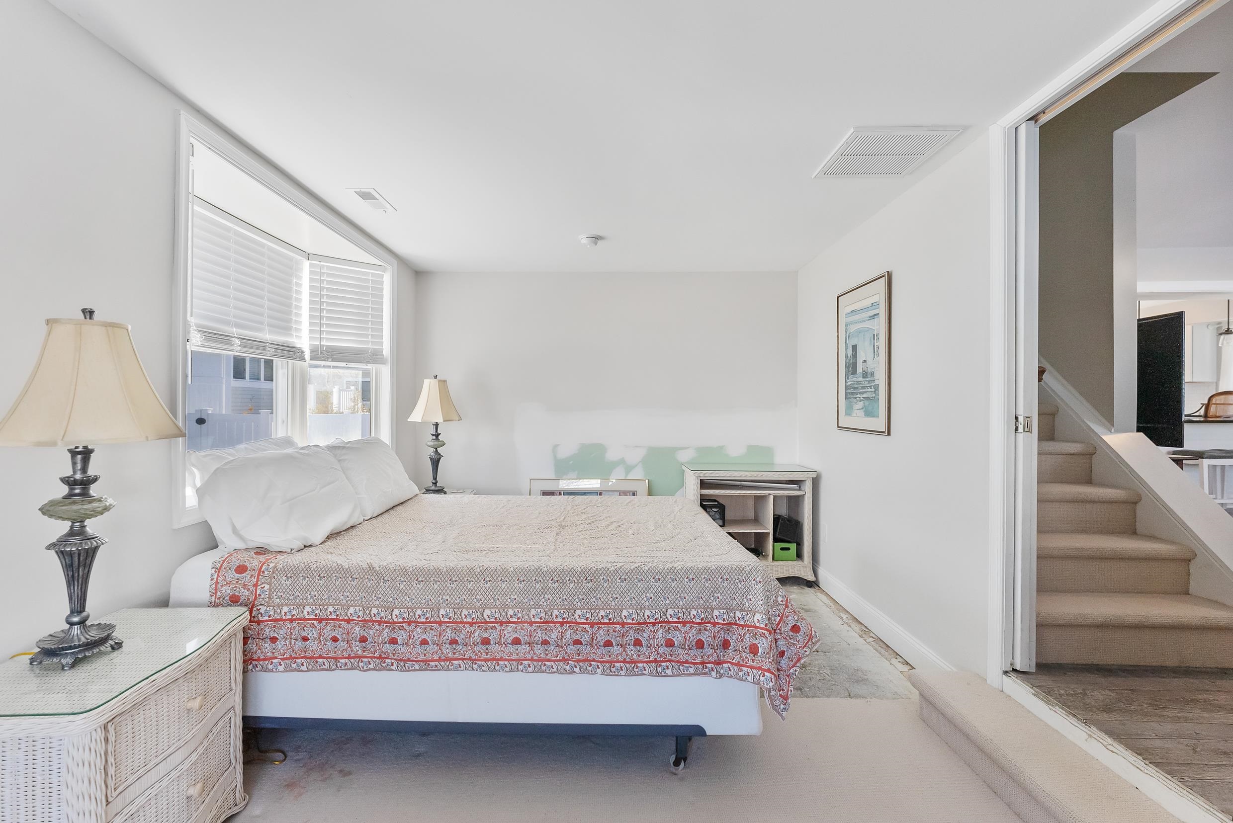 274 52nd Street Avalon, NJ 08202 - Photo 32 of 39 a bedroom with a large bed and a flat tv screen