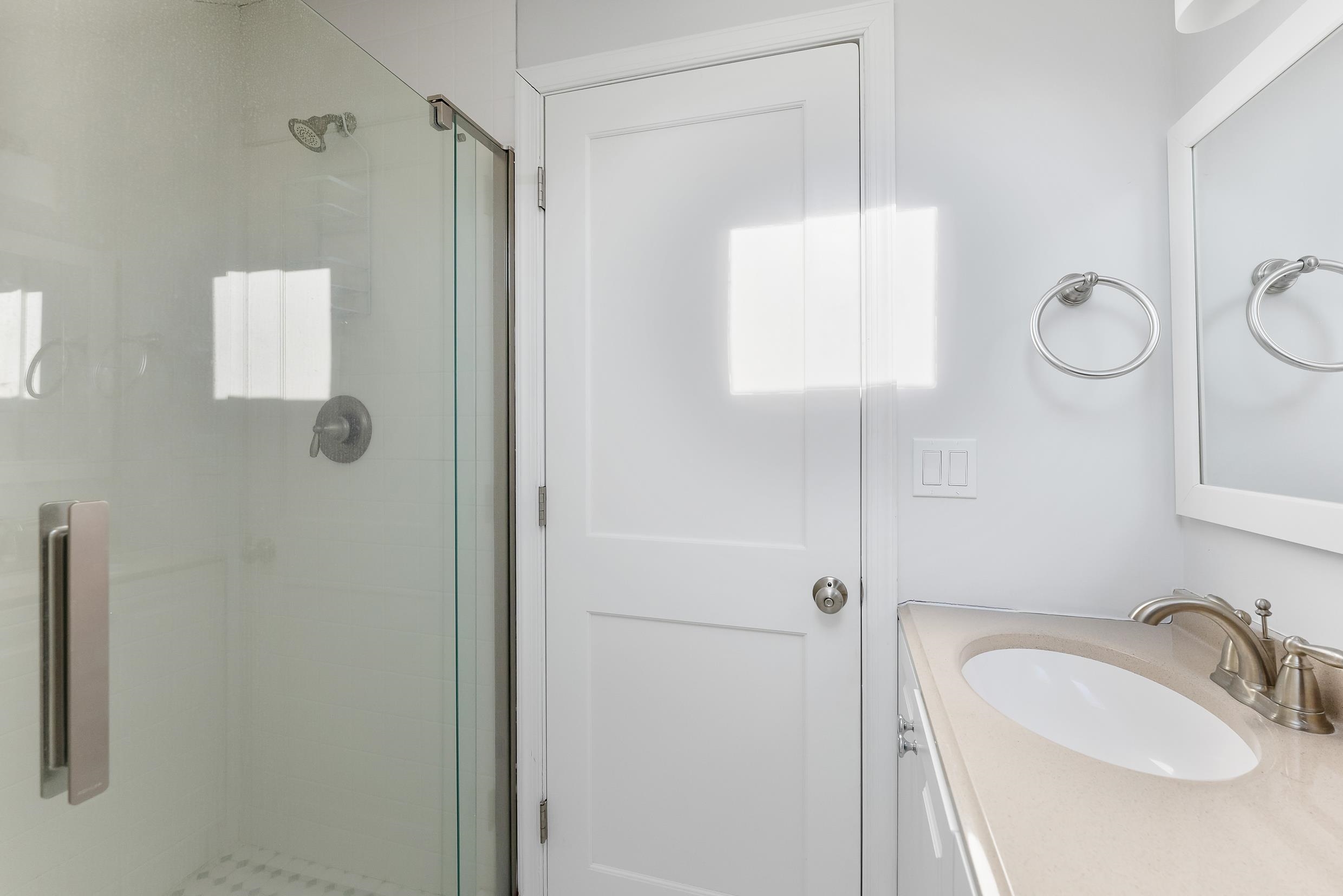 274 52nd Street Avalon, NJ 08202 - Photo 33 of 39 a bathroom with a sink and mirror