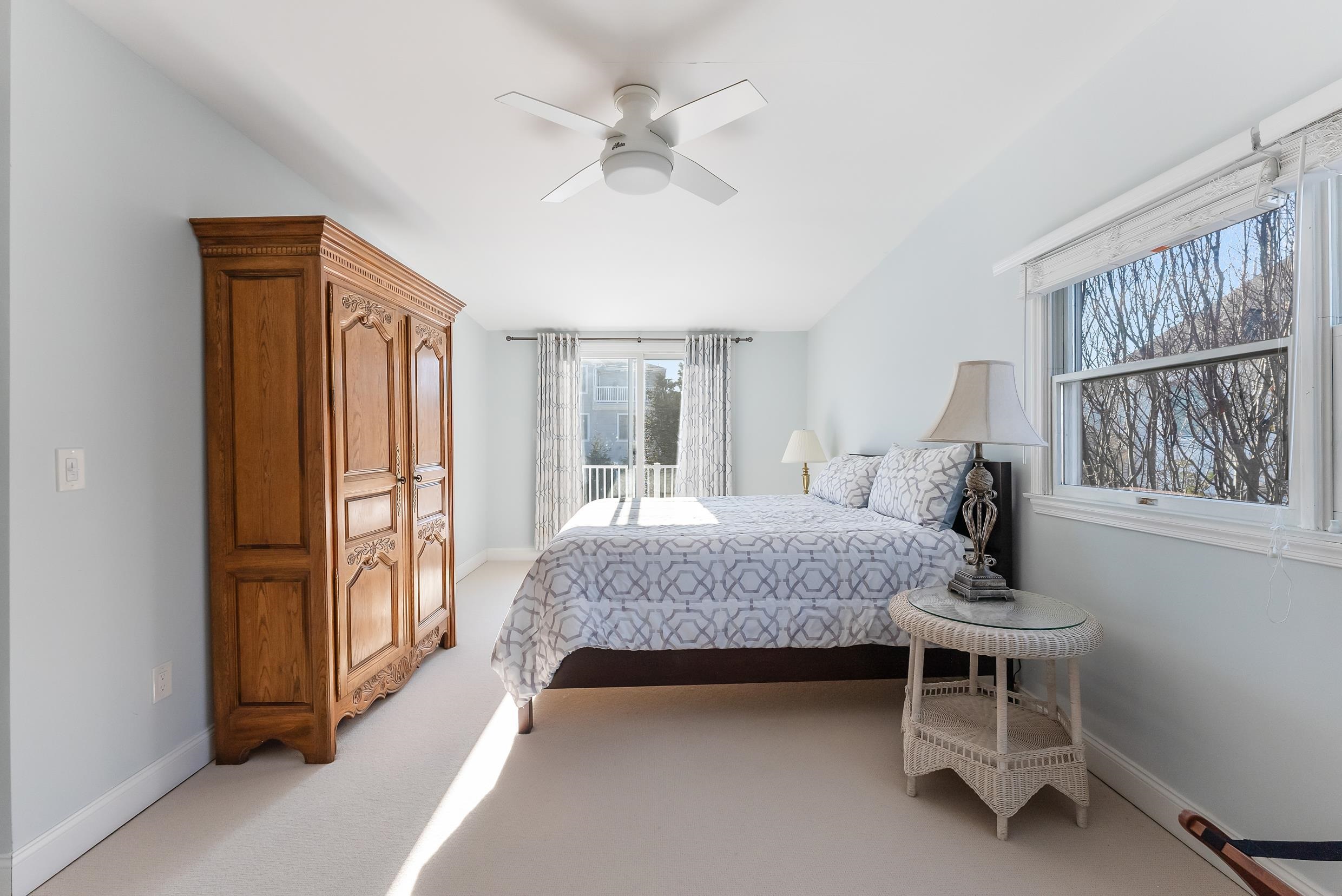 274 52nd Street Avalon, NJ 08202 - Photo 36 of 39 a bedroom with a bed and a chandelier